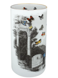 The Large Forum Vase by Christian Lacroix for Vista Alegre is a tall cylindrical porcelain piece adorned with black-and-white classical ruins and arches, accented by vibrant butterflies both inside and on the exterior—seamlessly blending timeless elegance with playful artistry.