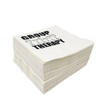 White cocktail paper napkin stack with the words "Group Therapy" printed on top. 