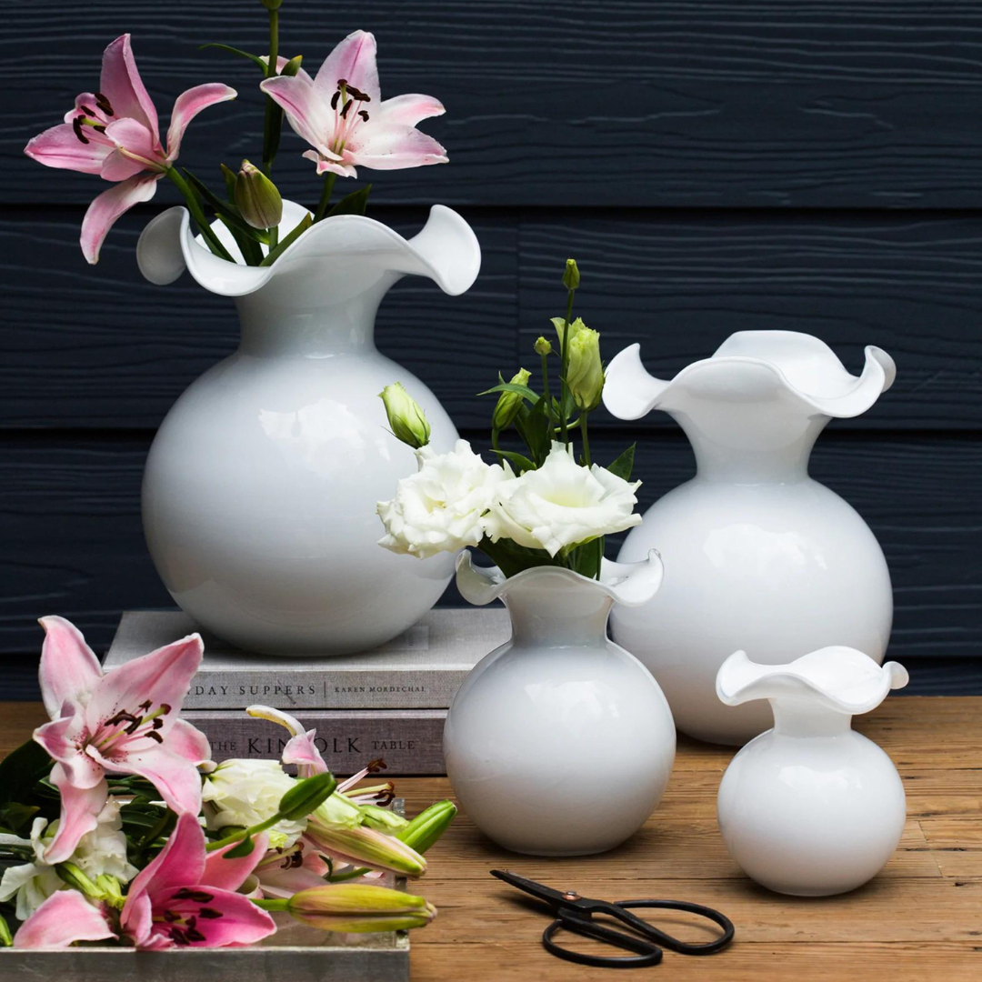 The hibiscus fluted vase is made with glass blown premium white glass.