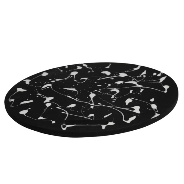 Black solid and white splattered chopping board. 
