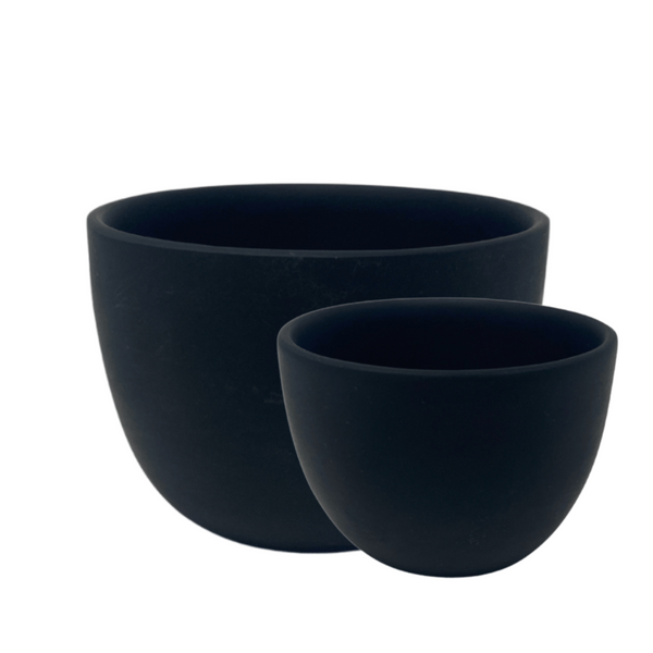 Medium and small black resin deep bowls.