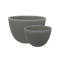 Medium and small grey resin deep bowls.