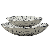 Medium and large white solid resin and black splattered bowl.