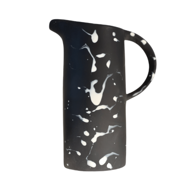 Black solid and white splatter resin pitcher.