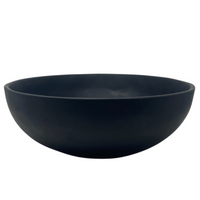Large black resin wave bowl.