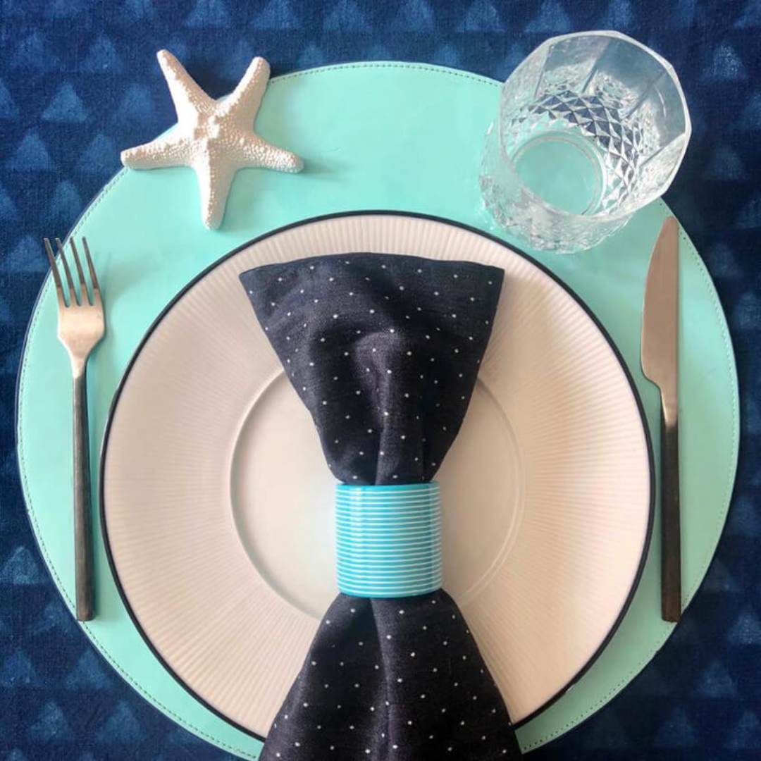 Turquoise patent leather placemat. 