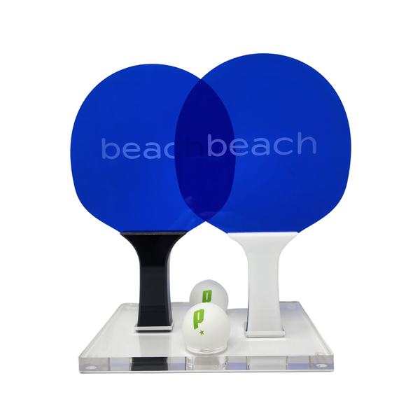 Beach ping-pong paddle set in blue acrylic with acrylic stand and balls. 