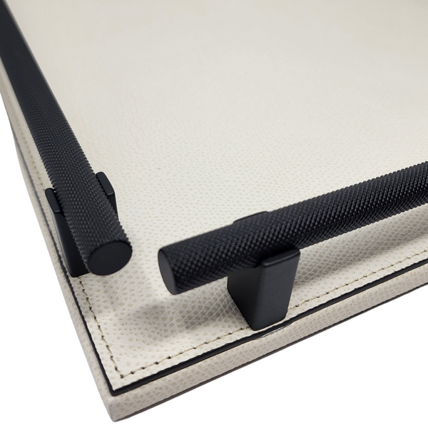 Cream leather tray with knurled black-finished burnished handles. 