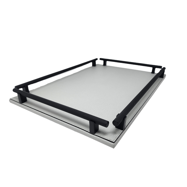 Light grey leather rectangular decorative tray with black handles. 