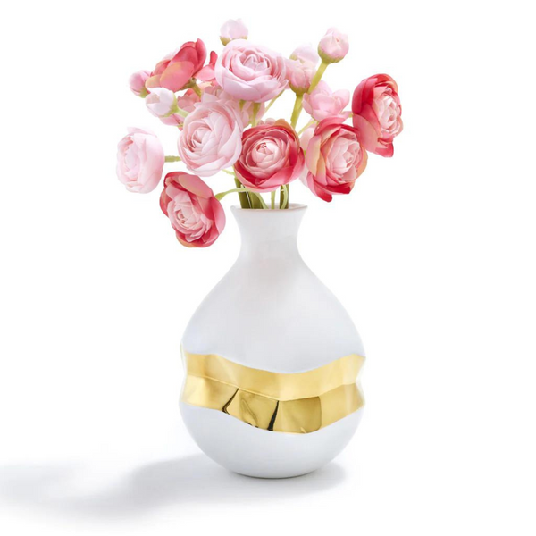 This white vase has a geometric 3D shape in the middle that is painted in gold. Vase is made of white ceramic, and has pink and red flowers.