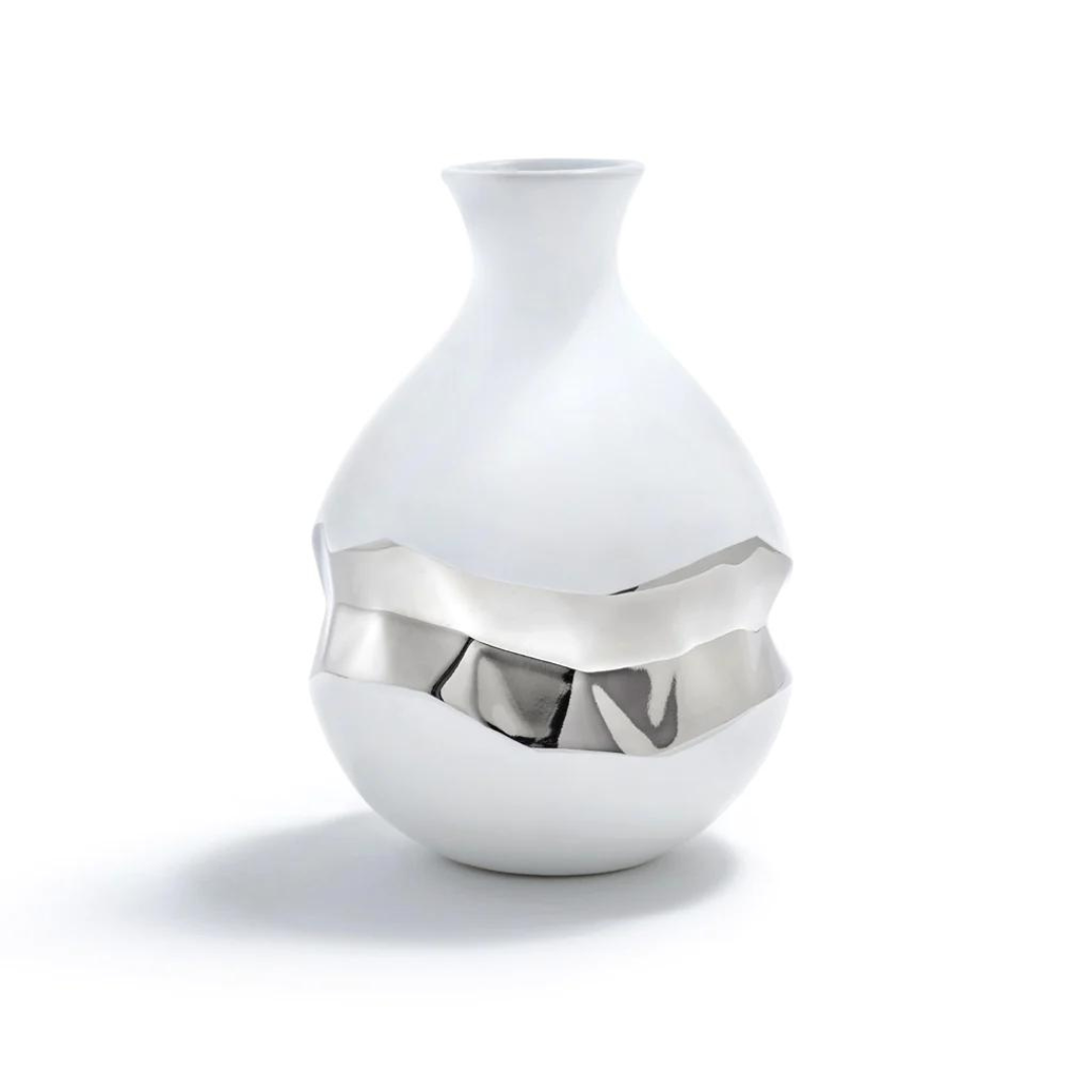 This vase is made of white ceramic and features a silver 3D geometric center.